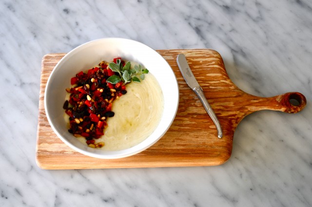Warm Taleggio cheese with pepper, currants and pine nuts 